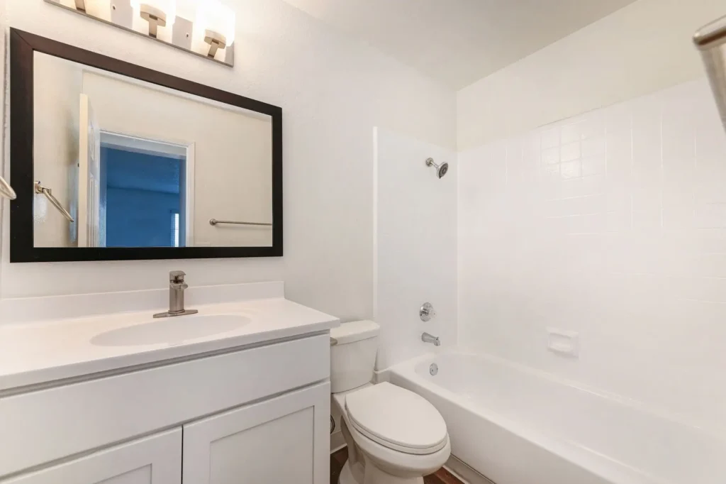 Bathroom with tub shower and toilet