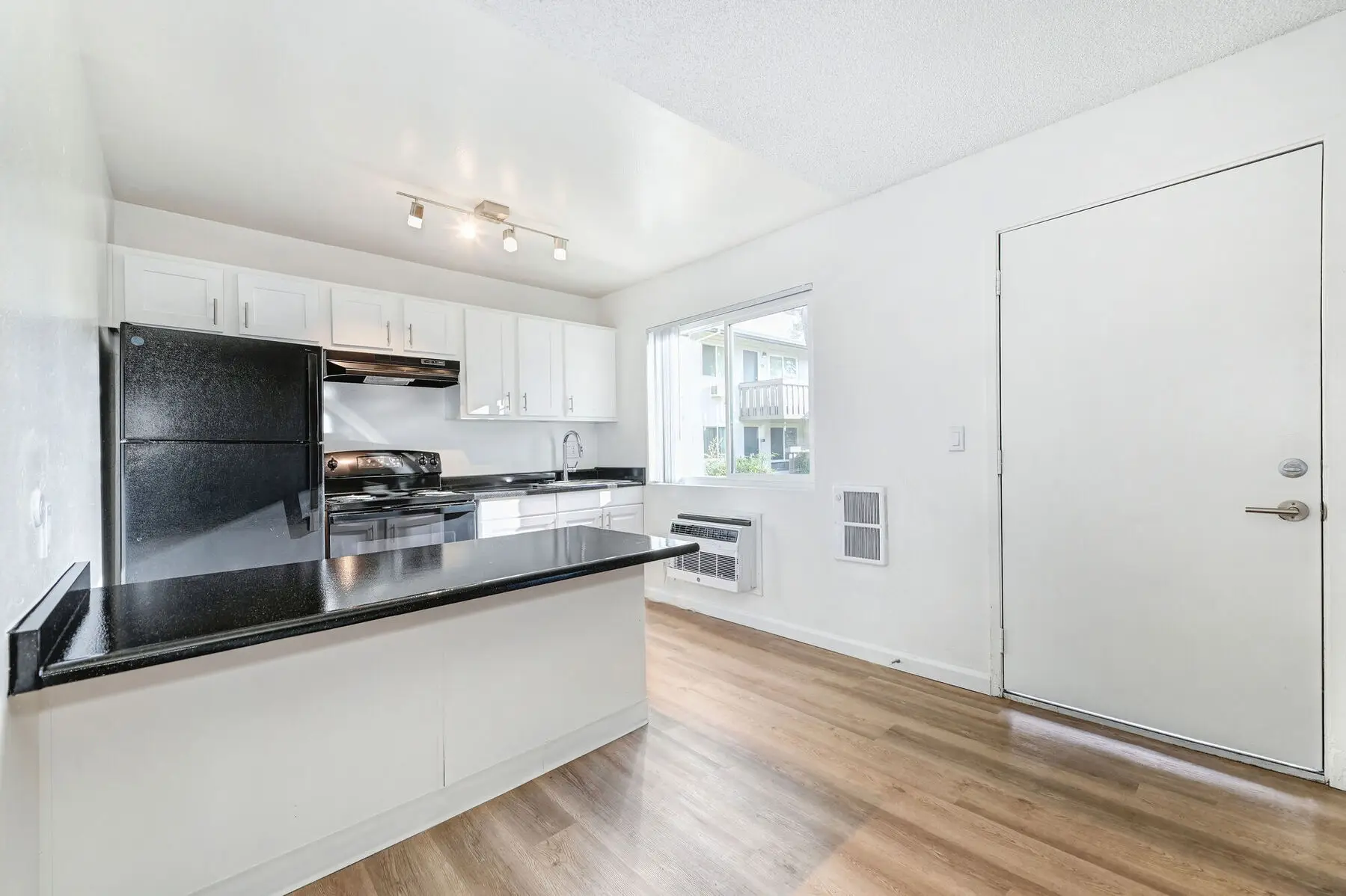 Front entrance and kitchen with breakfast bar