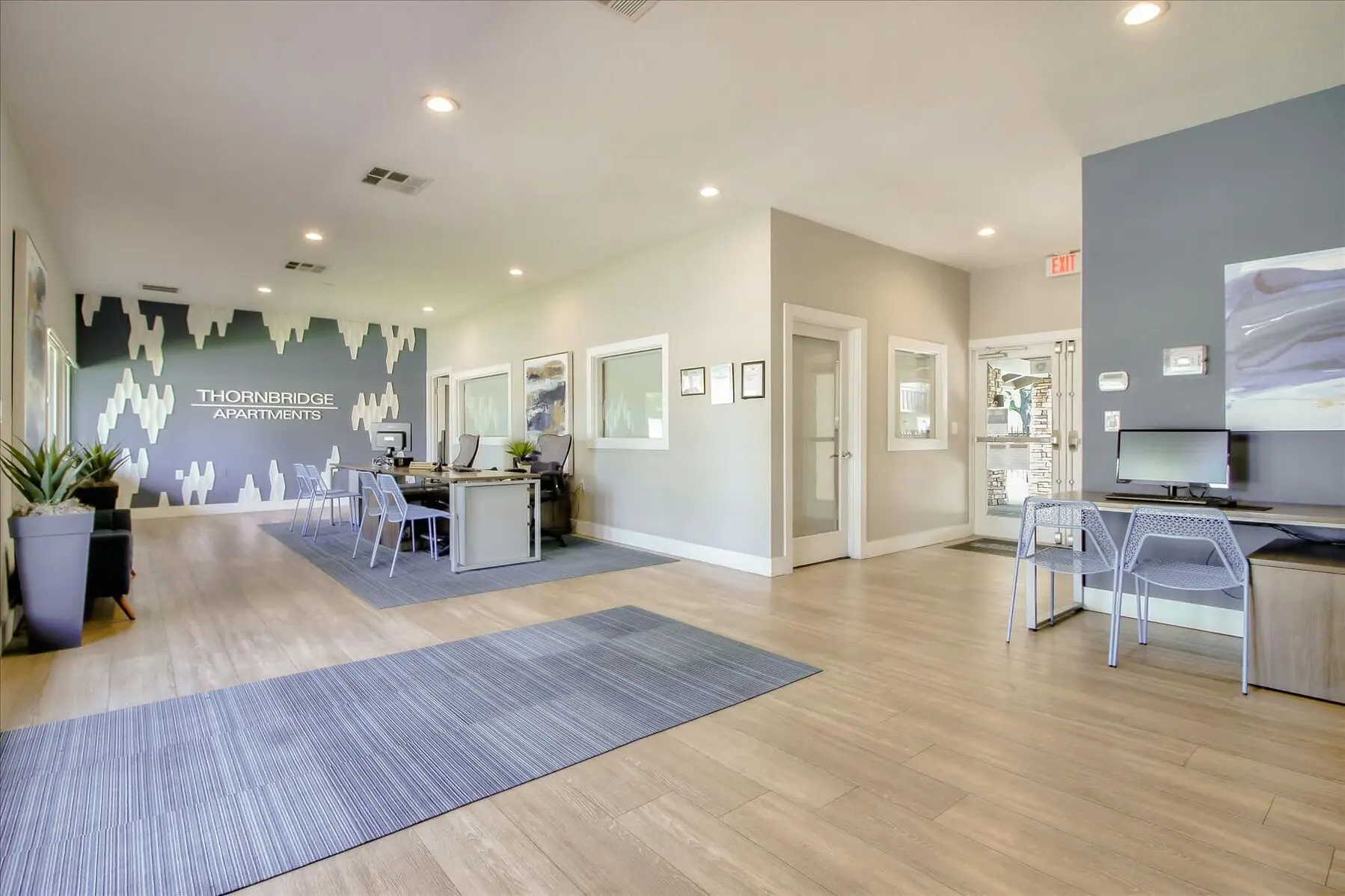 Leasing office interior with reception desk and computer stioations